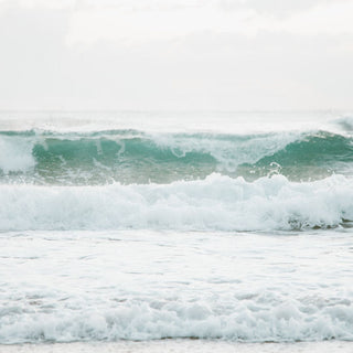 surf breaking on the beach creating whitewash