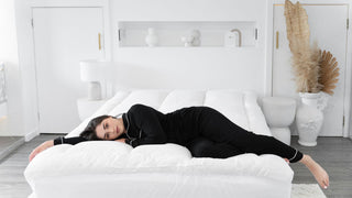 Lady lying on sienna living mattress topper